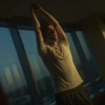 A young adult demonstrating posture training exercises in natural light, illustrating key heightmaxxing tips for better posture and confidence.